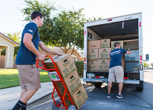 Mover using a dolly to load boxes